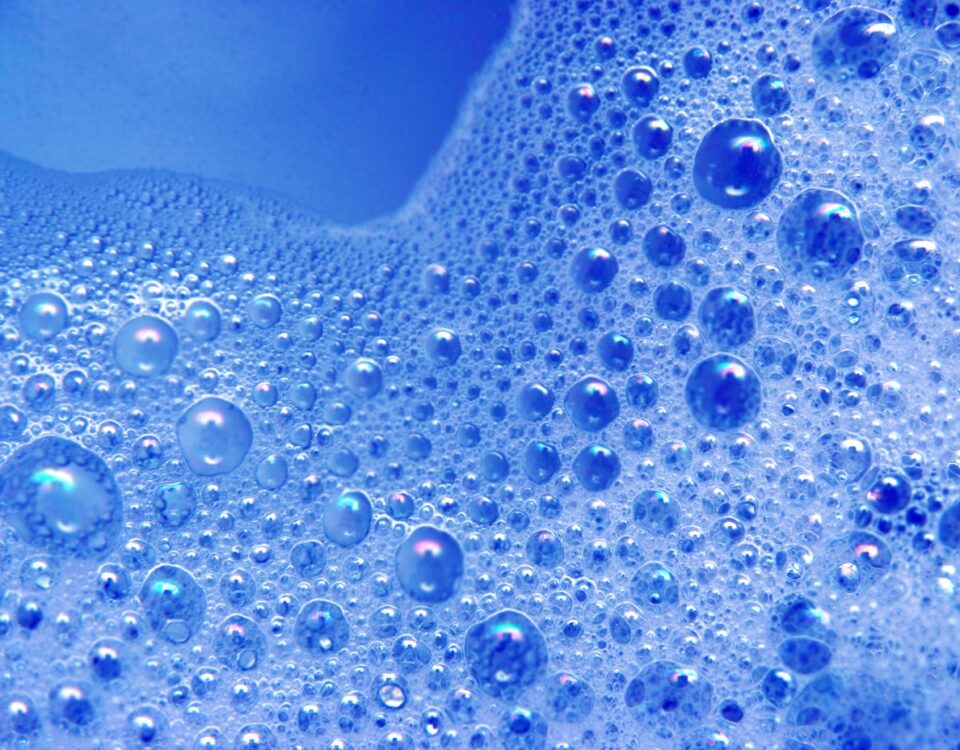 Iridescent blue bubbles of Hansanyl OS surfactant for effective industrial degreasing in hard water.